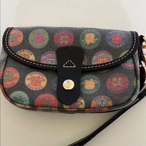 Dooney and Bourke Coated Canvas Wristlet in Logo Medallion Print